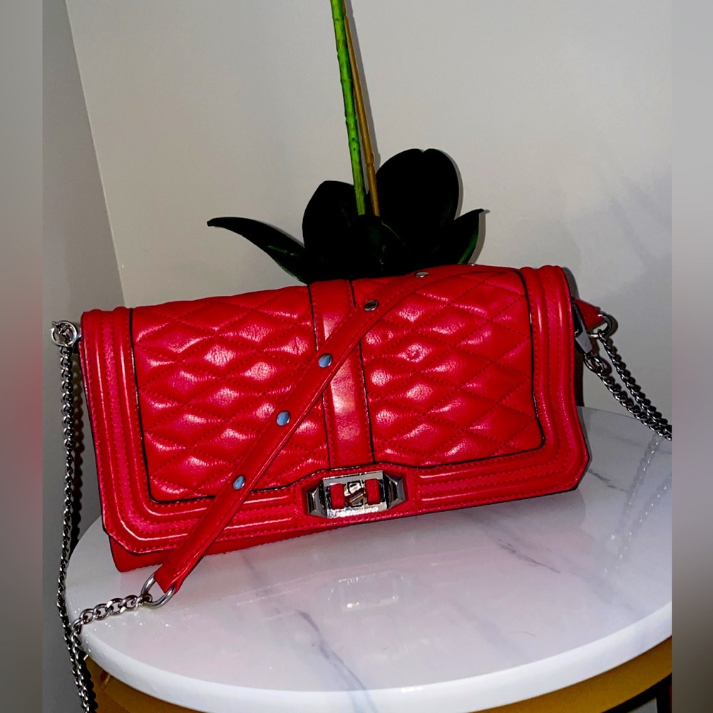 Red Rebecca minkoff crossbody with silver chain. Very good condition.